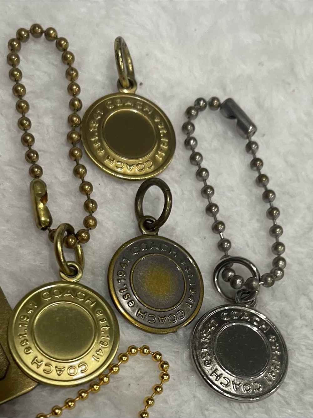 Choice of Coach Mixed Metal Round Tag Charms in Gold and Silver